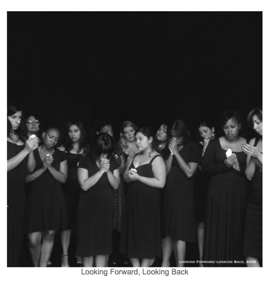 Young women standing in a group vigil. 